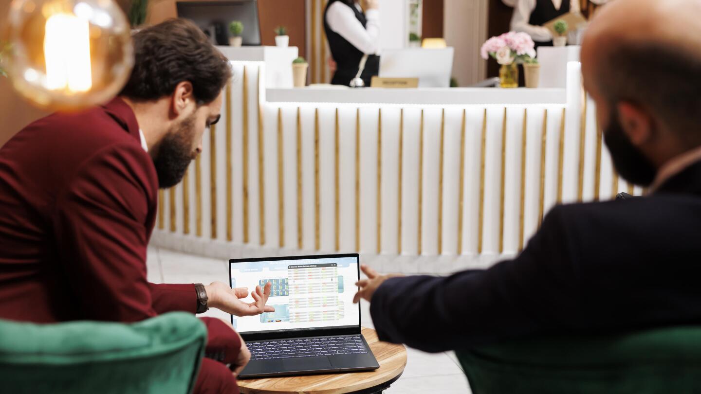 Enrtepreneurs exchanging ideas infront of laptop